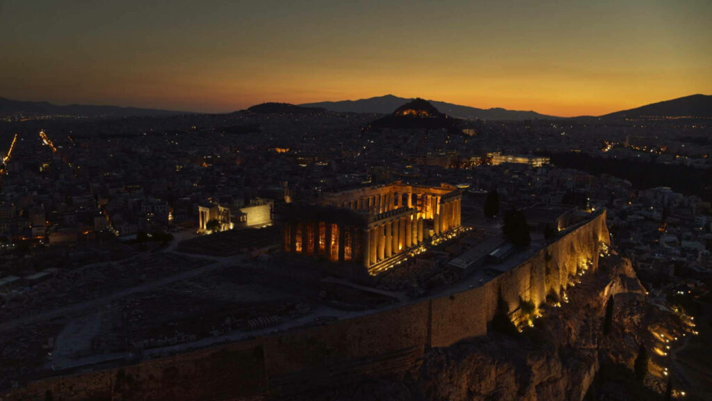Athens Acropolis at twilight glowing Parthenon cityscape and mountains wallpaper background