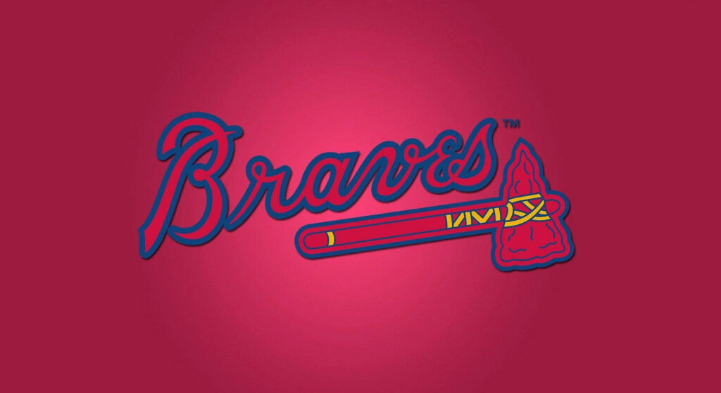 Atlanta Braves logo with script and tomahawk on vibrant red wallpaper background