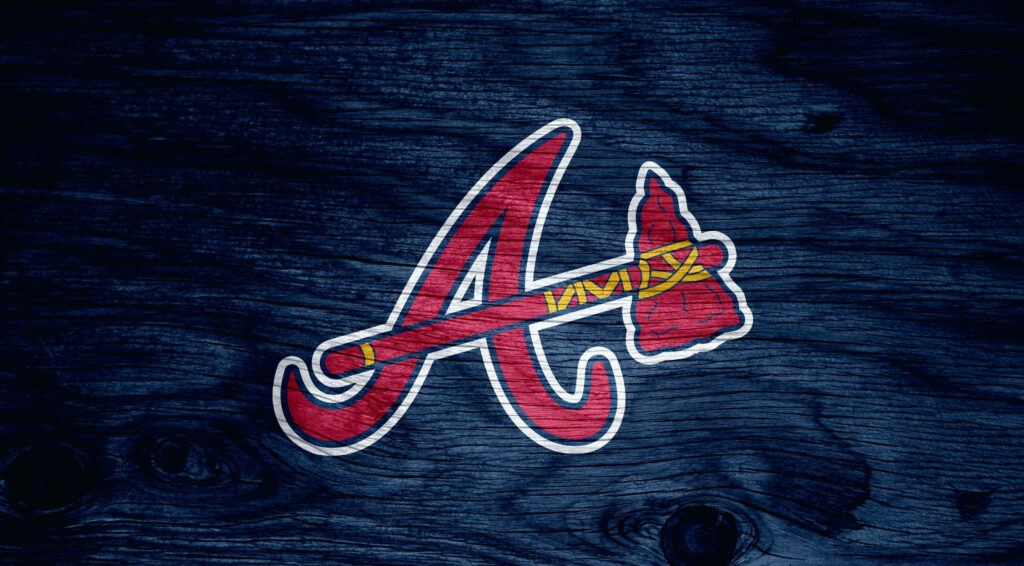Atlanta Braves logo on rustic dark timber wood background classic wallpaper design for fans