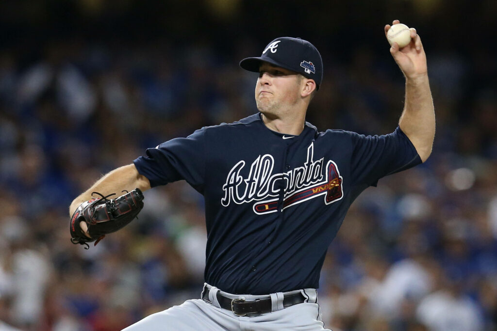 Atlanta Braves pitcher Alex Wood delivering a powerful pitch showcasing focus and athleticism Wallpaper