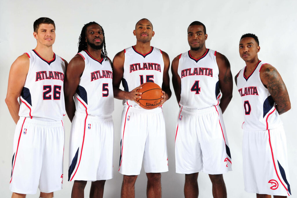 Atlanta Hawks first five lineup in official jerseys standing together on plain background wallpaper