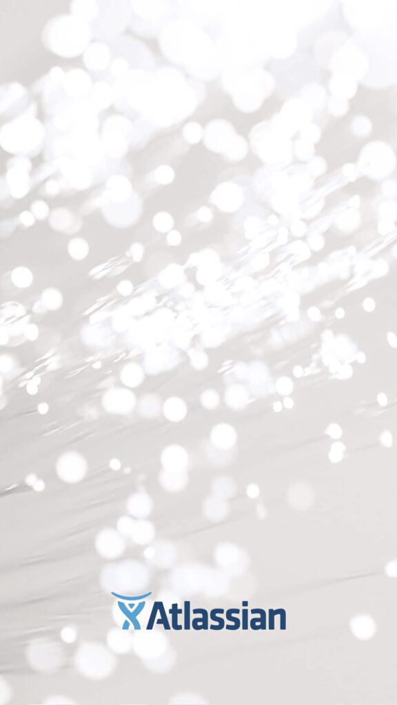 Atlassian wallpaper with soft abstract background glowing white bokeh lights and logo below