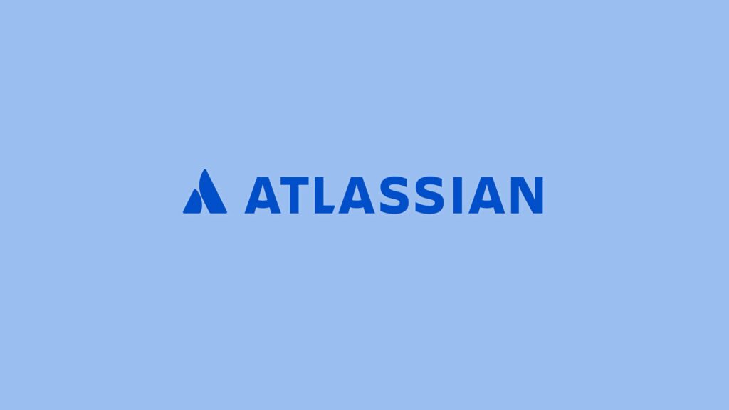 Atlassian logo centered on light blue background professional workspace wallpaper design