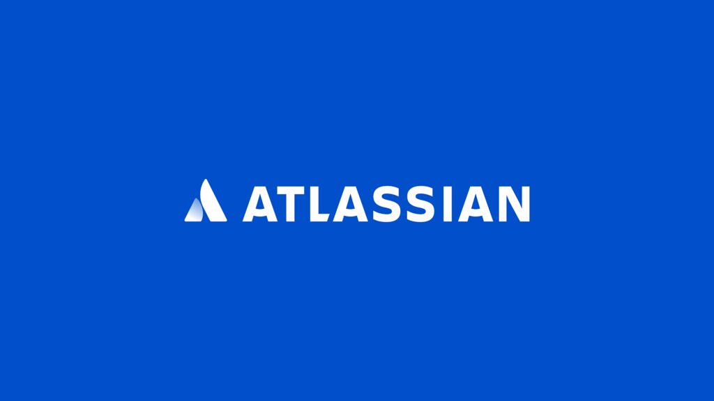 Atlassian logo and name in bold white text on vibrant blue wallpaper background professional design