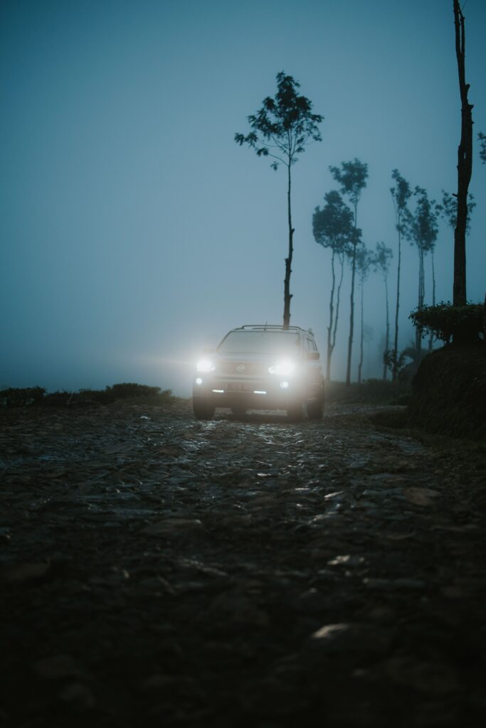 Mystical SUV in Foggy Twilight | Atmospheric Wallpaper Background