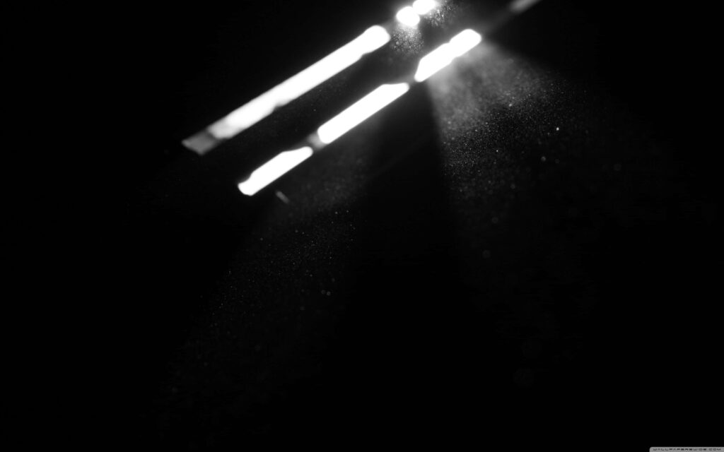 Atmospheric Wallpaper: Light Rays in a Dark, Minimalist Room Background
