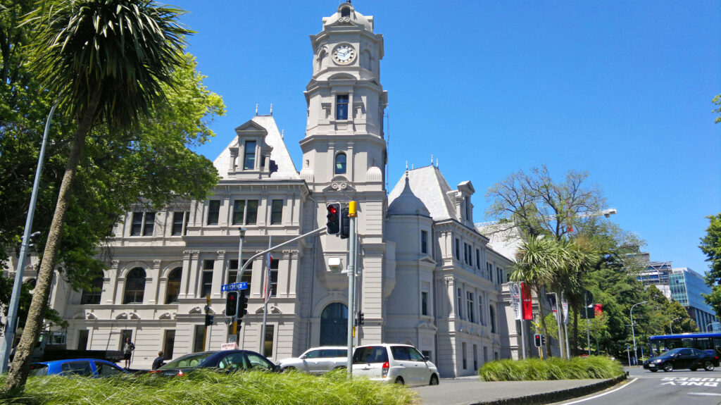 Auckland Art Gallery exterior bright day elegant historic architecture with green trees blue sky Wallpaper