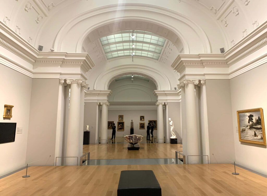 Elegant Auckland Art Gallery interior with grand arches classical columns and diverse artworks wallpaper