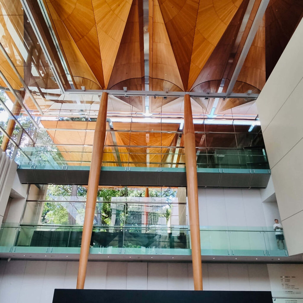 Auckland Art Gallery interior with soaring wooden ceilings glass balconies modern design wallpaper