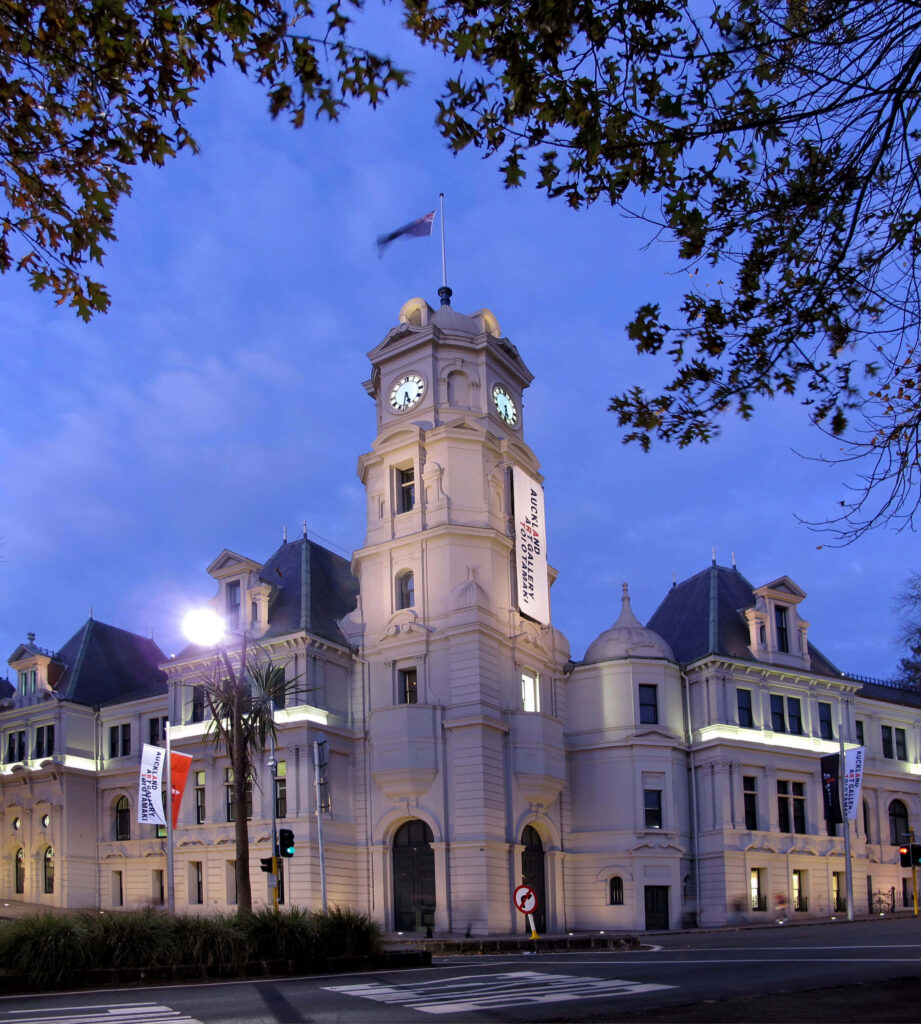 Auckland Art Gallery historic building illuminated at twilight with dusky sky wallpaper background