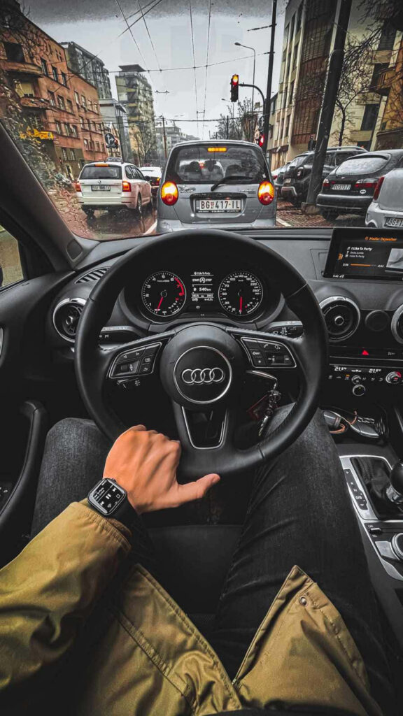 Audi cockpit view on city street showcasing luxury driving experience and sleek design wallpaper