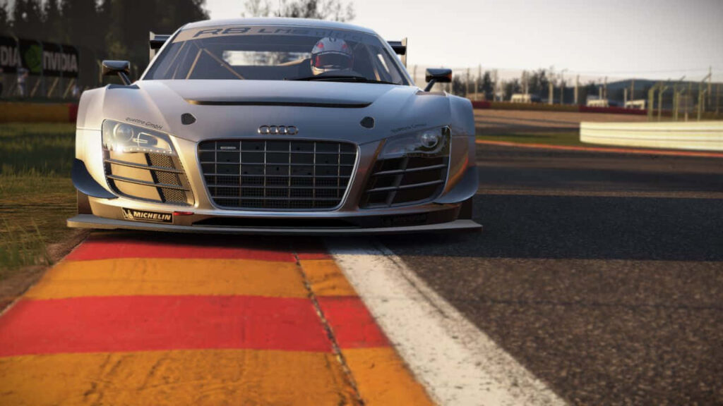 Audi R8 LMS racing on track at high speed hugging curve in Project Cars game wallpaper background