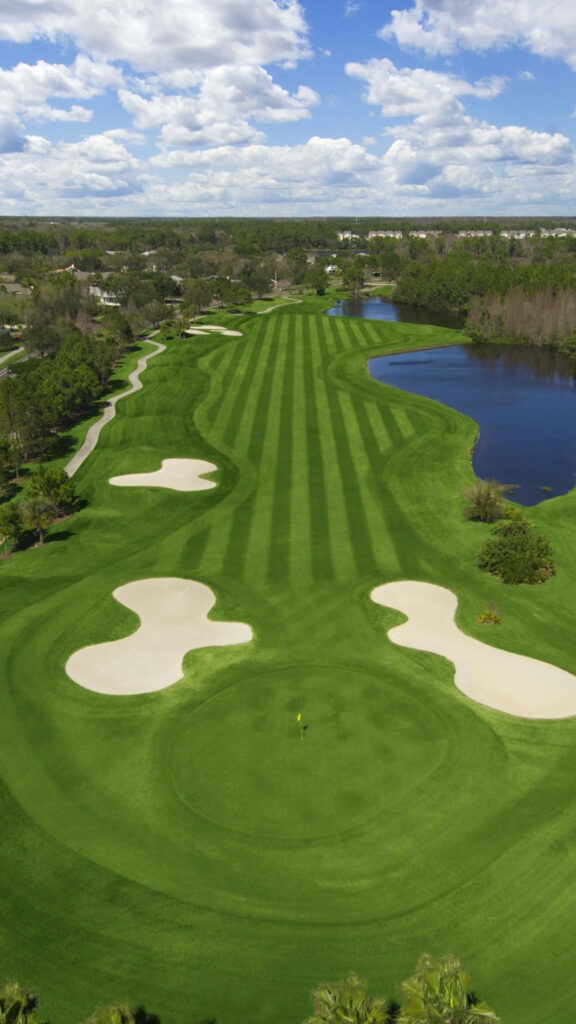 Augusta National Golf Course fairways and greens under blue sky Masters Tournament wallpaper