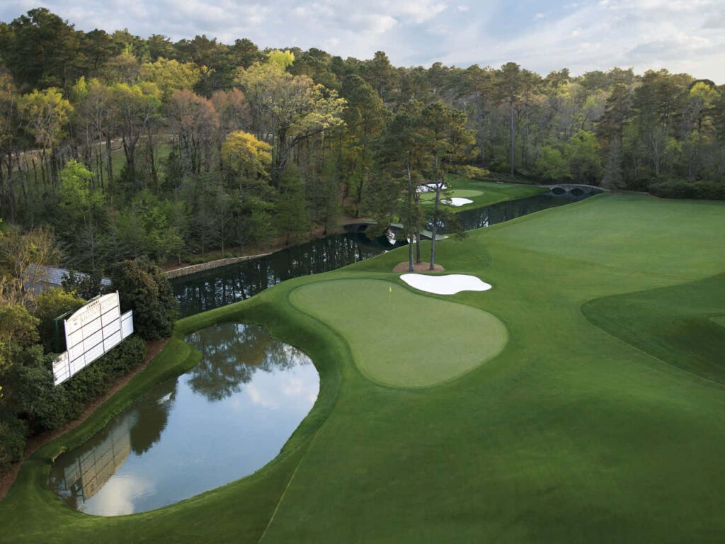 Augusta National Golf Course wallpaper with lush fairways pond and tree-lined serene scenery