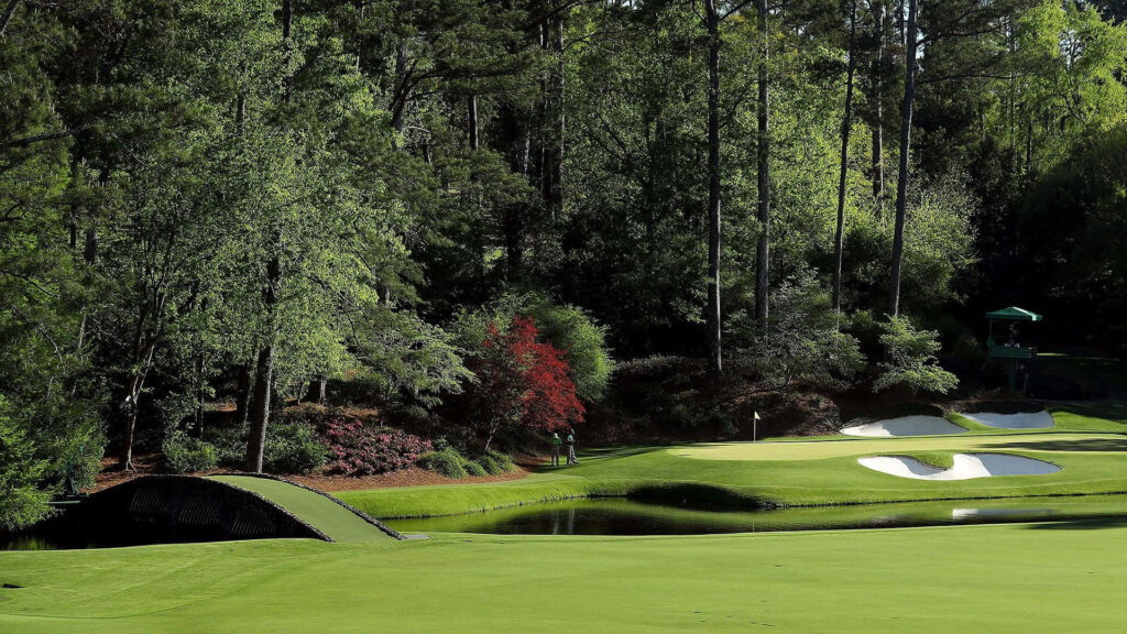 Augusta National Golf Course lush green fairways tall trees serene water hazard scenic view Wallpaper