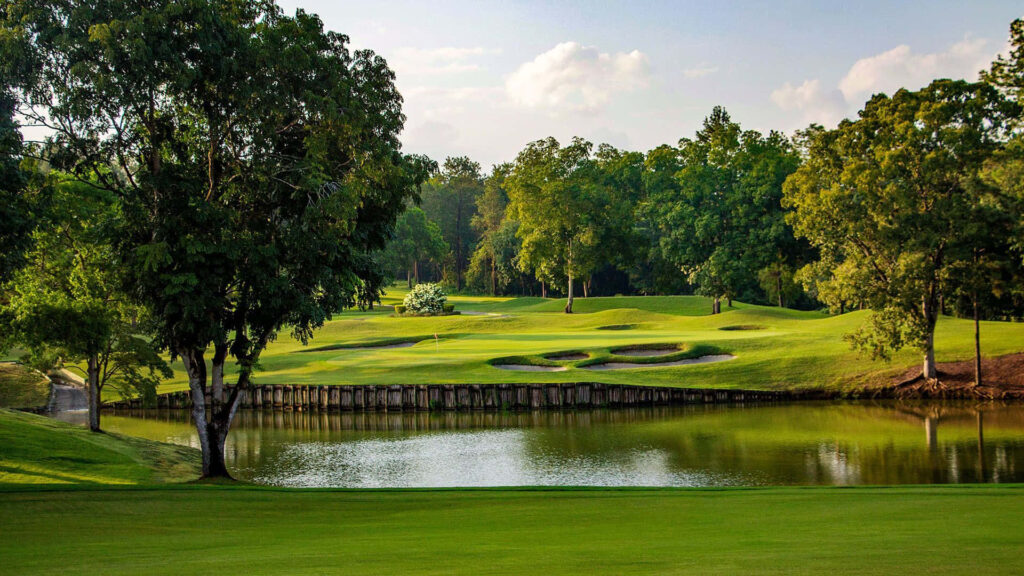 Augusta National Golf Course wallpaper with green fairways water features and majestic trees