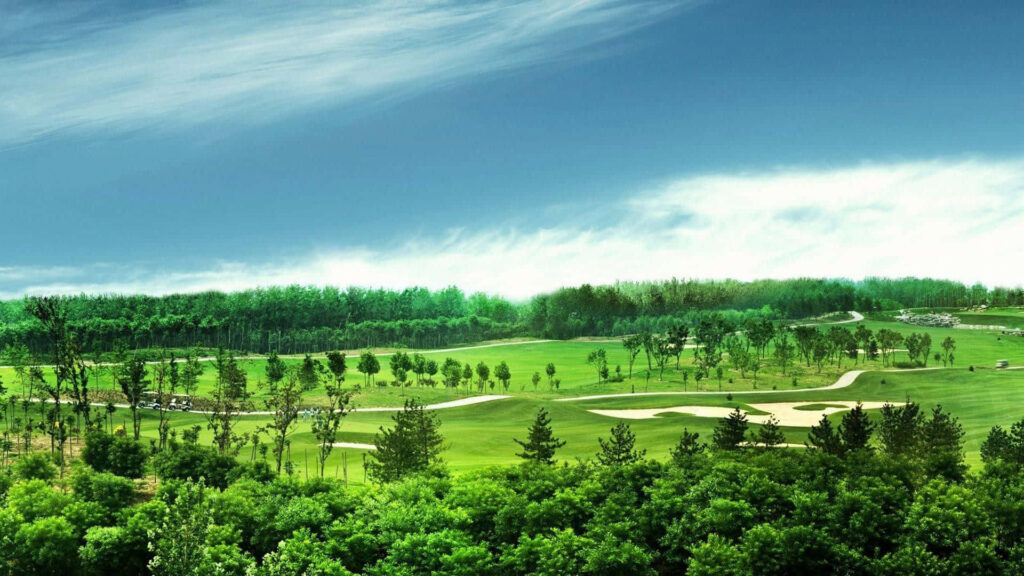 Augusta National Golf Course lush fairways and greens under bright blue sky wallpaper background