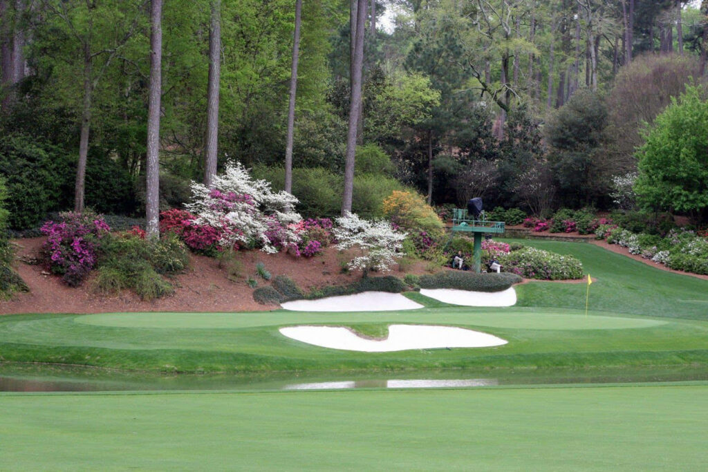 Augusta National Golf Course pristine fairways greens framed by trees vibrant flowering bushes wallpaper