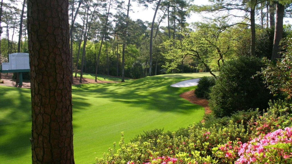 Augusta National Golf Course wallpaper with manicured fairways lush greenery and iconic scoreboard