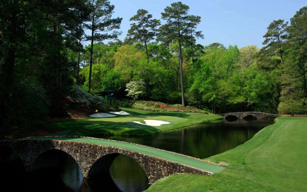 Augusta National Golf Course with lush fairways iconic stone bridges and vibrant foliage wallpaper