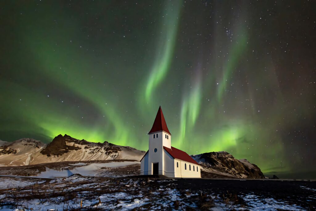 Aurora Borealis Wallpaper: Serene Snowy Landscape & Charming Church