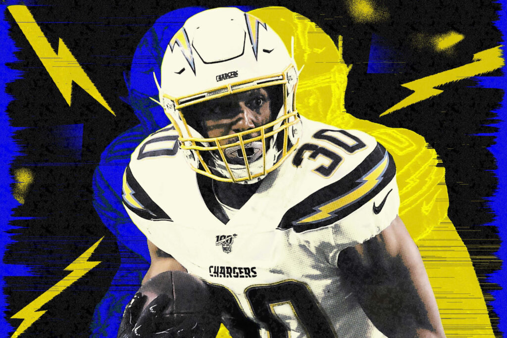 Austin Ekeler running back in Los Angeles Chargers uniform with blue yellow lightning background Wallpaper