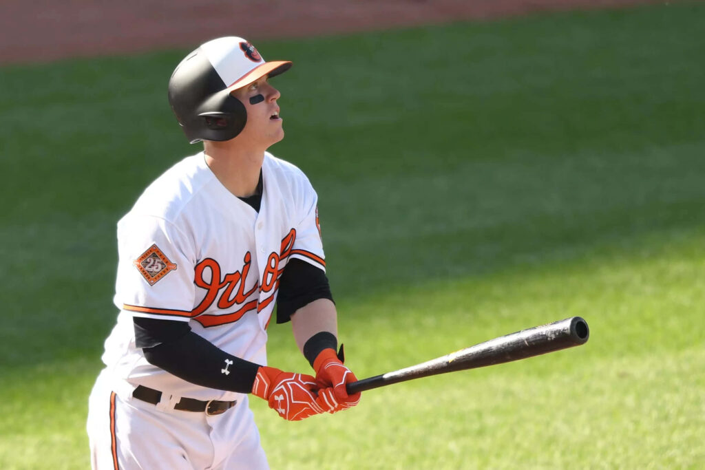 Austin Hays Baltimore Orioles mid-action batting focused intense game day baseball player image Wallpaper