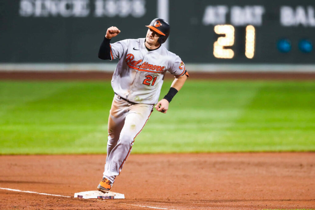 Austin Hays Baltimore Orioles baseball player rounding base during game action wallpaper background