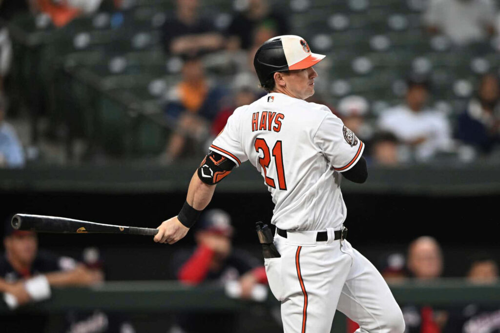 Austin Hays mid swing baseball player showing focus and athleticism dynamic action wallpaper background