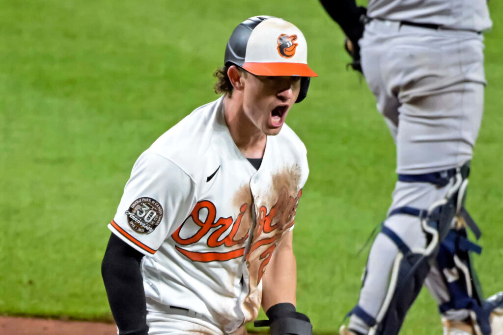 Austin Hays Orioles celebrates intense energy victory on baseball field wallpaper background