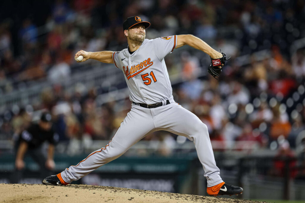 Austin Hays Orioles mid-pitch intense focus athleticism baseball game wallpaper background
