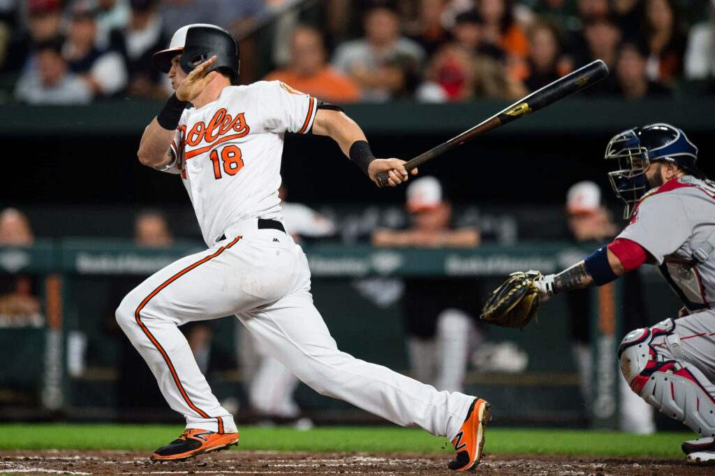 Austin Hays Orioles mid swing powerful batting stance vibrant baseball action wallpaper background