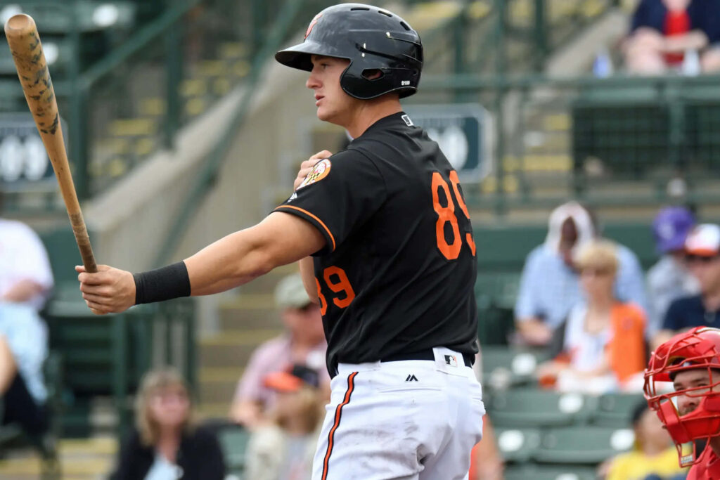 Austin Hays Orioles batter in action at plate dynamic baseball game wallpaper background