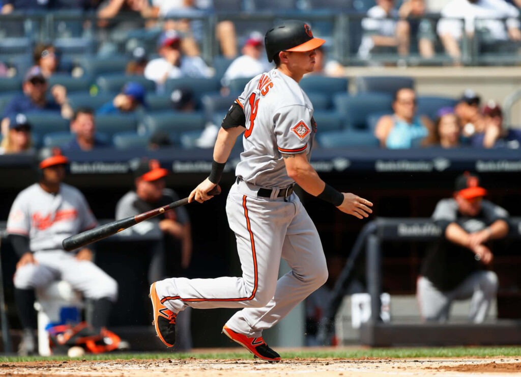 Austin Hays powerful swing follow through intense focused professional baseball player action wallpaper