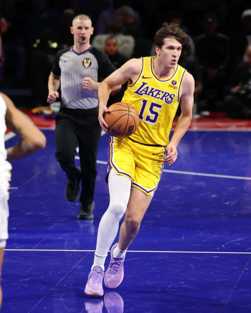 Austin Reaves Lakers basketball player driving down court showcasing focus and athleticism wallpaper