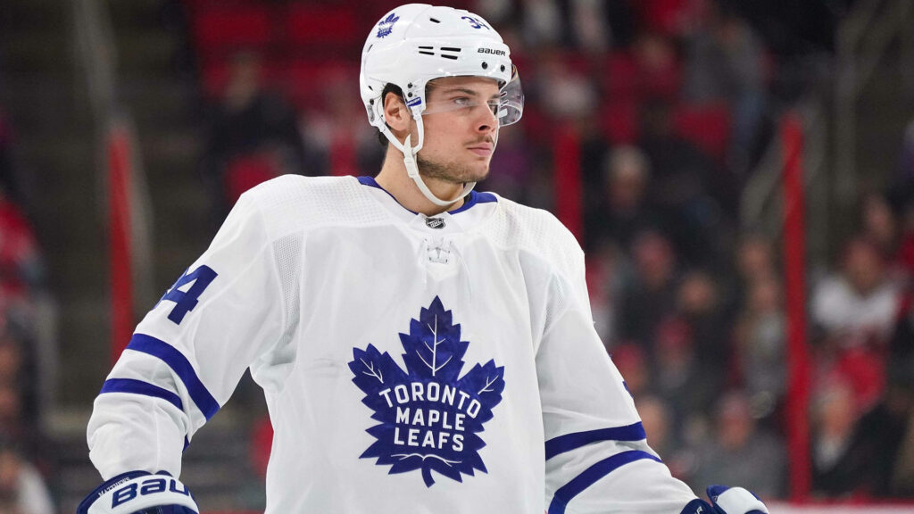 Auston Matthews Toronto Maple Leafs focused on ice ready for next play in hockey game wallpaper