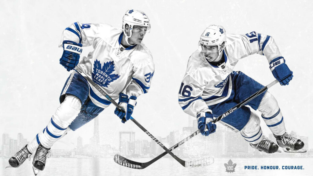 Auston Matthews and Mitch Marner skating for Toronto Maple Leafs with city skyline background Wallpaper