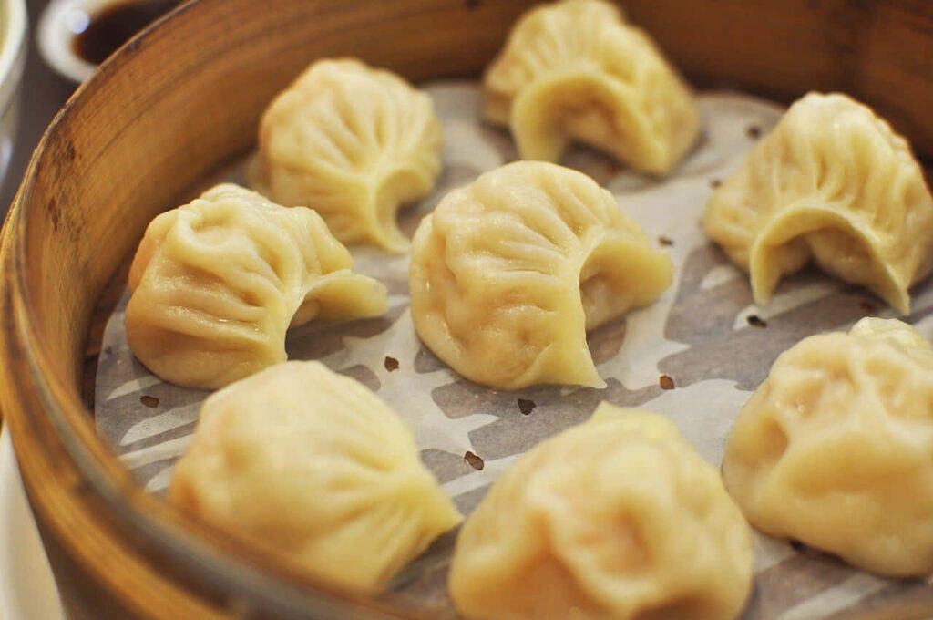 Delicious Chinese Dumplings in Bamboo Steamer | Authentic Cuisine Wallpaper