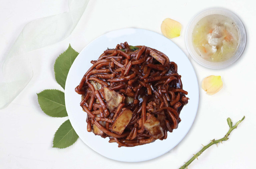Authentic Dark Hokkien Mee Wallpaper with Soup on White Background