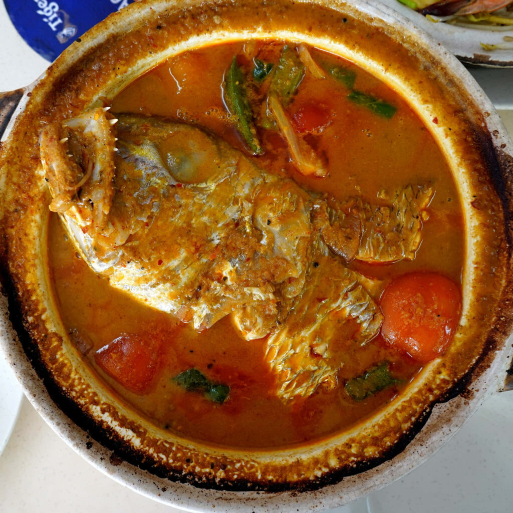 Authentic Fish Head Curry in Clay Pot - Flavorful Wallpaper Background