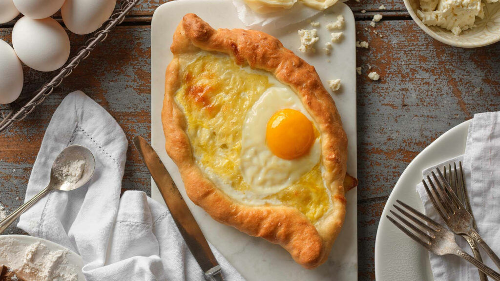 Authentic Georgian Khachapuri Wallpaper: Golden Cheese & Egg Delight