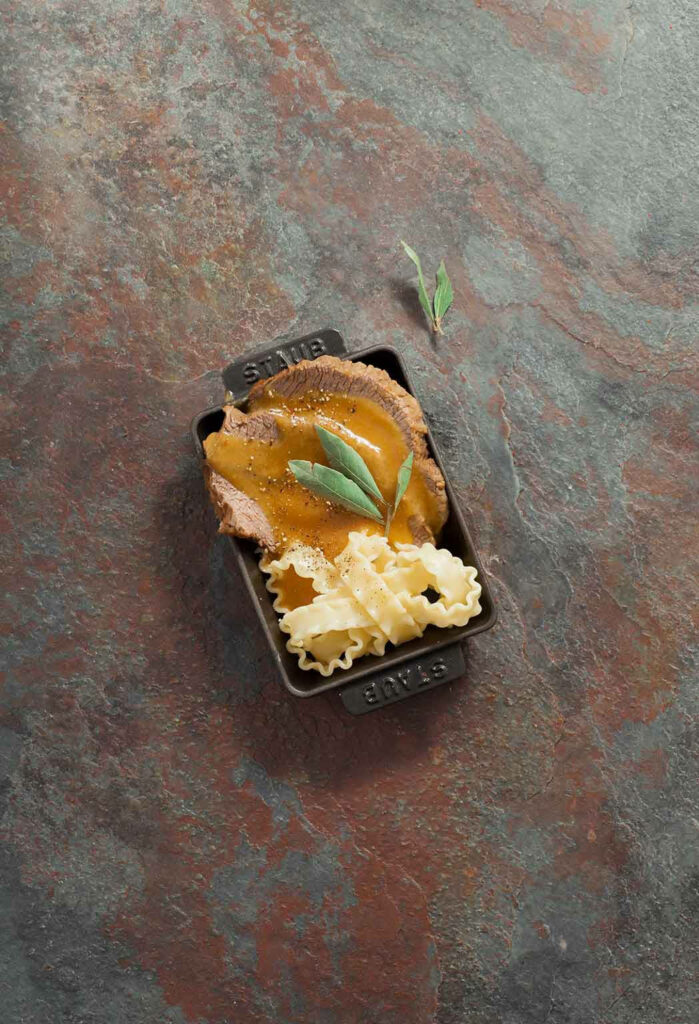Rustic Wallpaper: Authentic German Sauerbraten in Iron Casserole