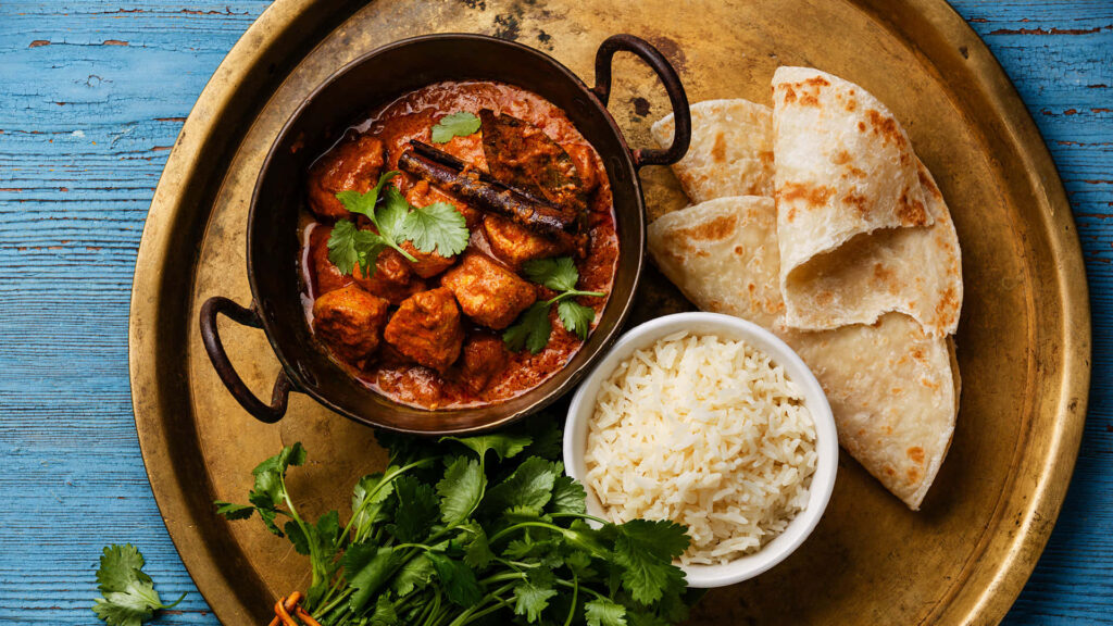 Vibrant Indian Cuisine Wallpaper: Chicken Tikka Masala & Flatbread