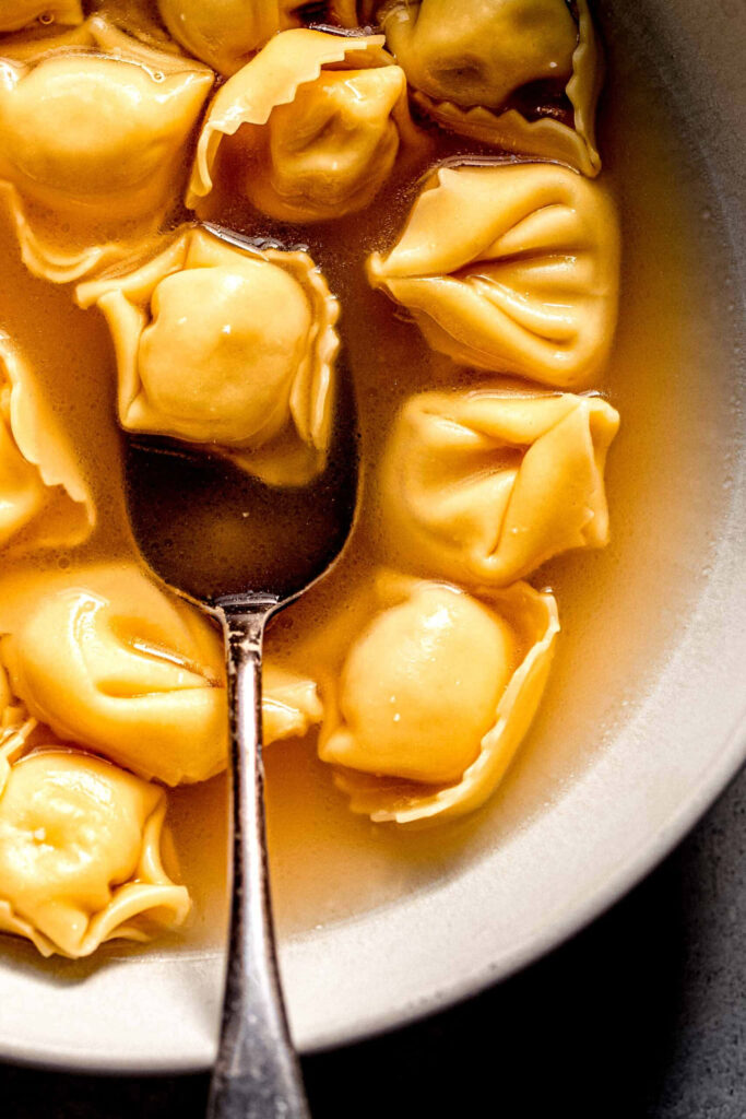 Authentic Italian Tortellini in Brodo: Warm Wallpaper Background