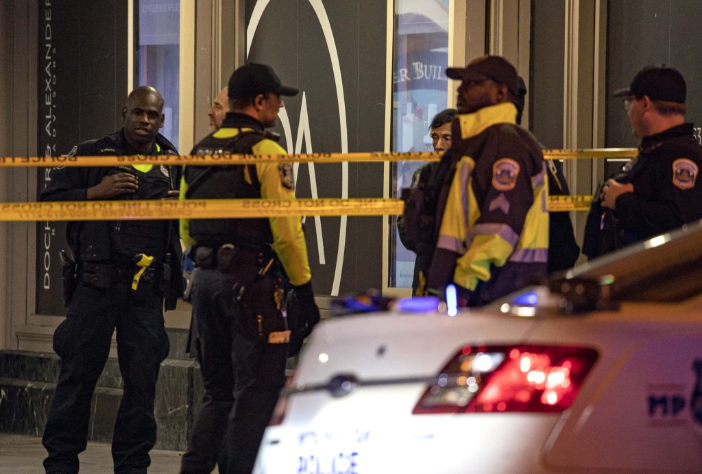 Crime scene wallpaper Metropolitan Police officers behind caution tape with police cruiser at night