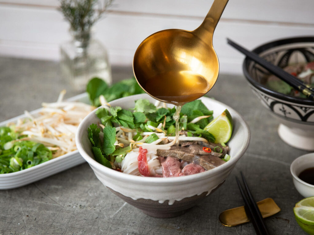 Authentic Vietnamese Pho: Delicious Bowl with Fresh Herbs & Broth Wallpaper