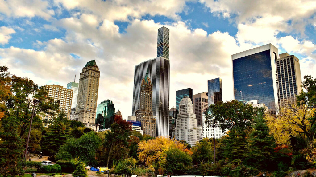 Autumn in Central Park: Vibrant Foliage & Skyscrapers Wallpaper
