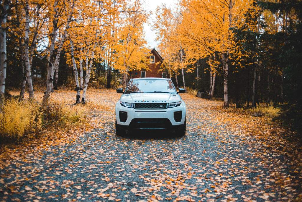Stunning Autumn Drive Wallpaper: White Land Rover & Fall Foliage