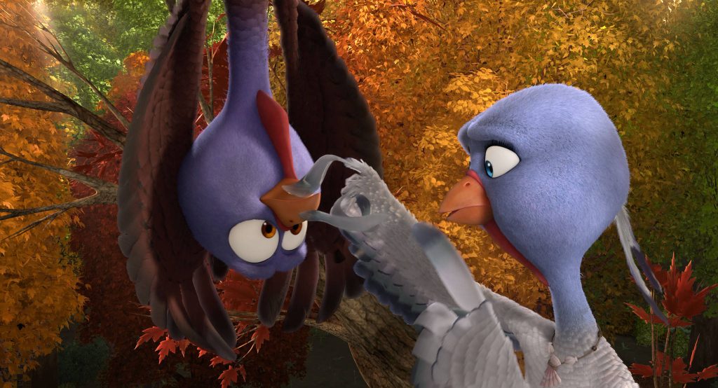 Free Birds wallpaper with Reggie and Jenny turkeys in vibrant golden autumn forest scene