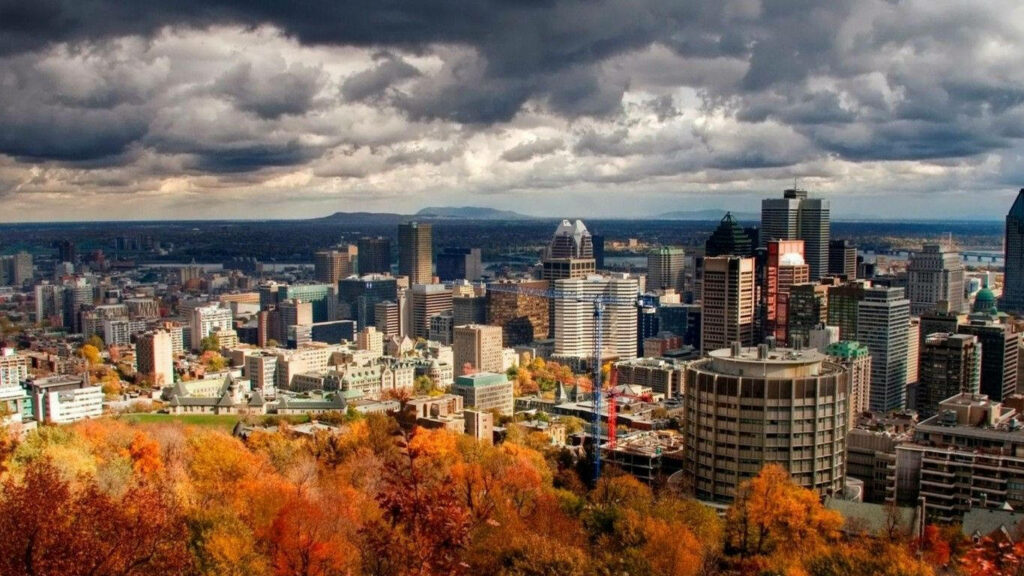 Vibrant Autumn Quebec City Wallpaper Background with Urban Skyline